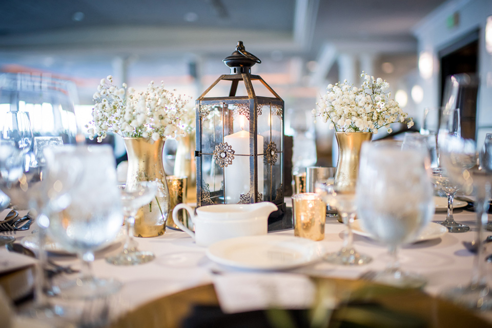 Admiral Kidd Club table setting with white décor with black and gold accents