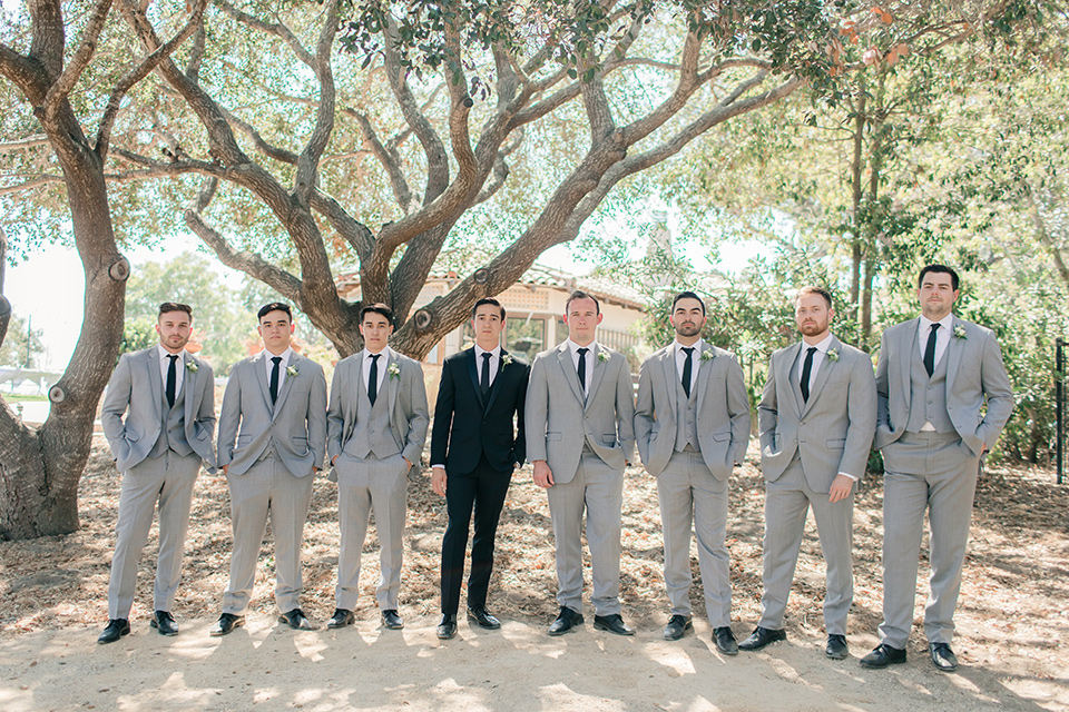 Arroyo-Grande-Wedding-groom-and-groomsmen-the-groom-wore-a-traditional-black-tuxedo-and-black-long-tie-while-the-groomsmen-wore-light-grey-suits