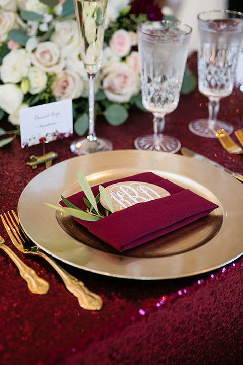 temecula weding table decor with burgundy linens and gold flatware