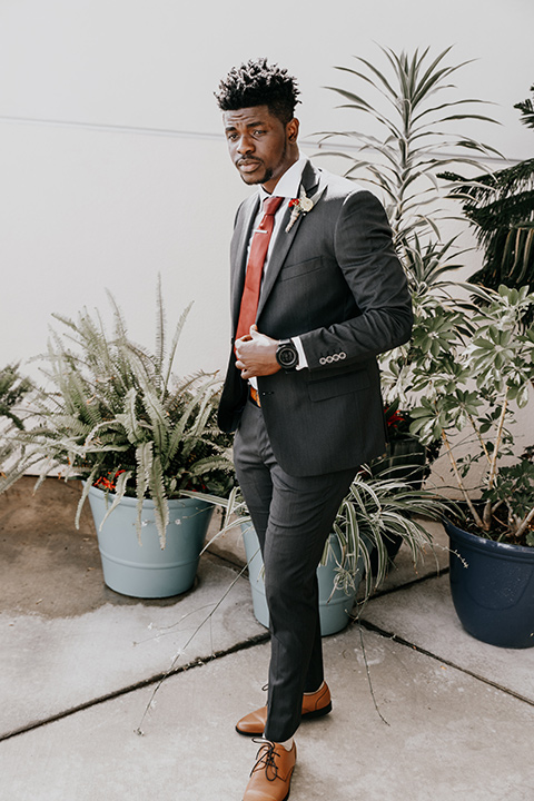 coronado-yacht-club-wedding-groom-standing-in-a-charcoal-suit-with-a-red-tie