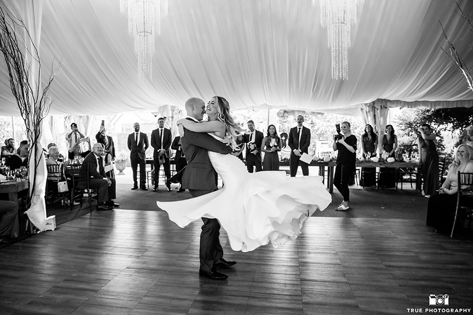 twin-oaks-weddings-first-dance-bride-in-a-strapless-fit-and-flare-gown-with-a-sweetheart-neckline-groom-in-a-charcoal-grey-suit-with-black-long-tie