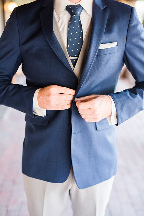 tanque-verde-ranch-arizona-wedding-close-up-on-groom-in-grey-pants-and-a-blue-suit-coat