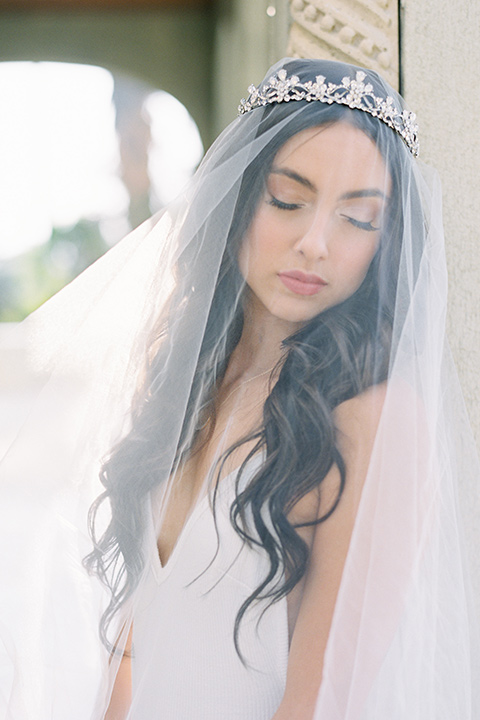 Kimberly-crest-house-shoot-bride-with-veil-in-a-flowing-white-gown-with-a-full-skirt