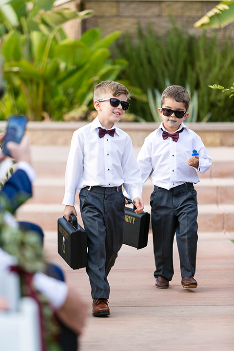  ring barers in white and grey outfits 