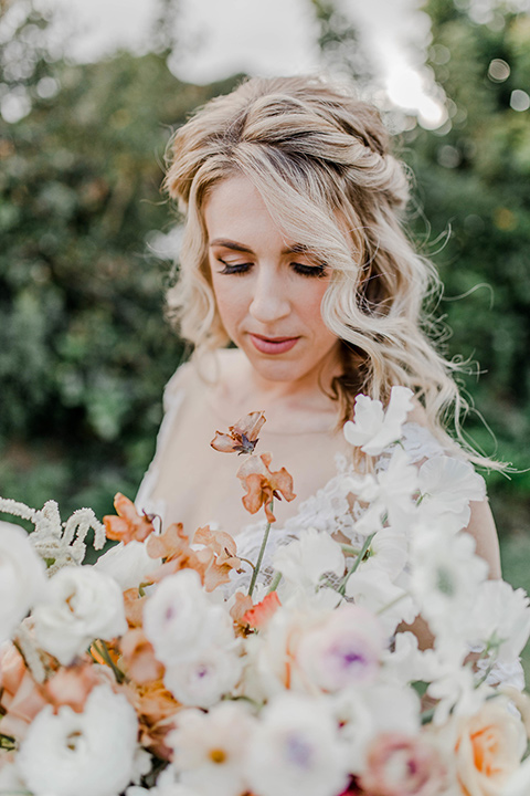 bridal hair in loose curls and braided crown