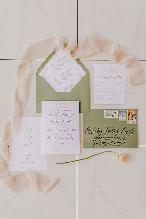 white invitations with sage green envelopes