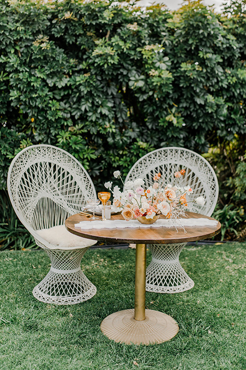 white wicker chairs with wooden table