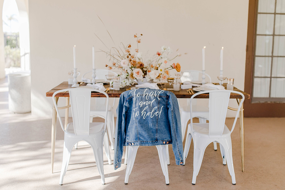 wooden tables with white farm chairs and details