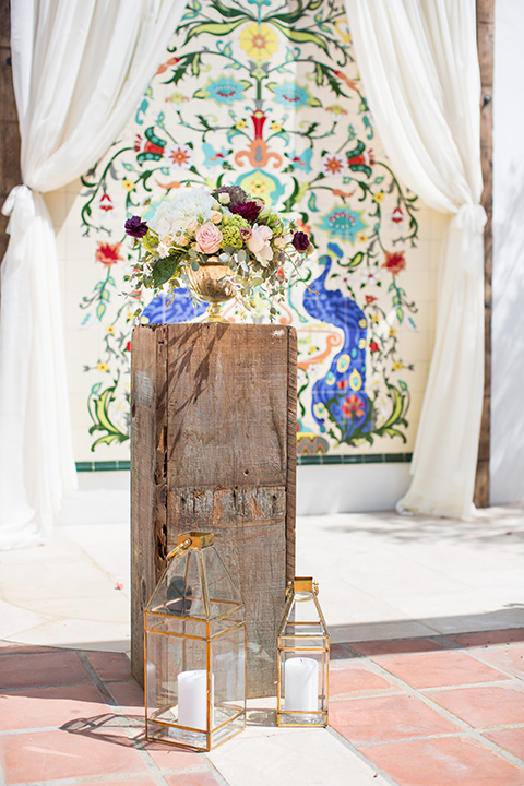 wooden ceremony décor with colorful tile wall