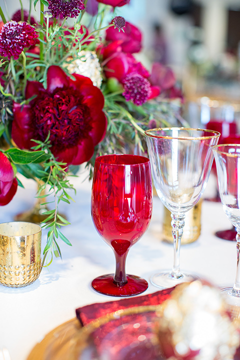 red and gold table décor and flatware