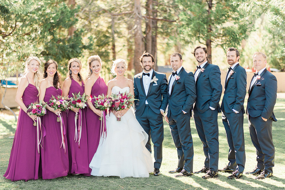 The wedding party poses for photo