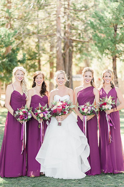 The bride and bridesmaids pose for a photo