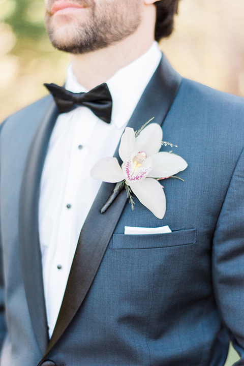 Close up of the groom's notch lapel suit