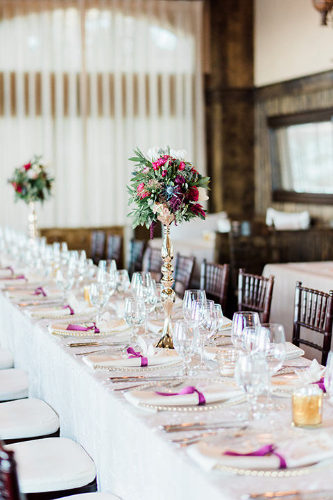 Lake Tahoe wedding table décor with white linens and gold flatware