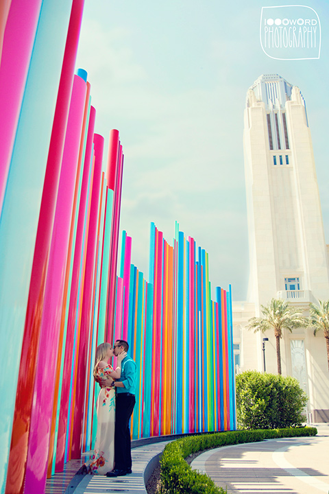 couple pose for engagement photo at symphony park 