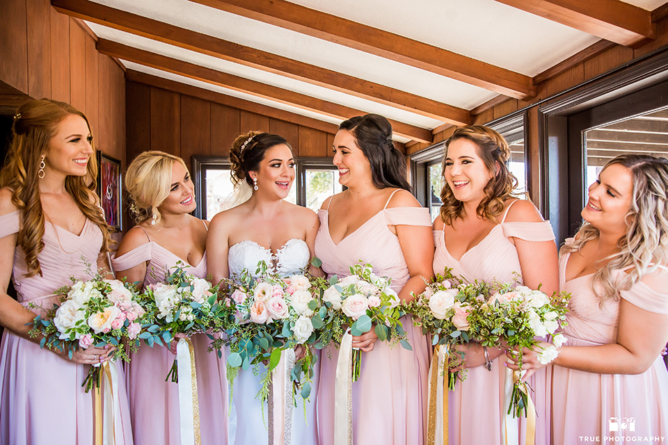 mount-woodson-castle-bridesmaids-in-light-pink-long-dresses-bride-in-a-mermaid-gown-with-lace-detailing-and-a-sweetheart-neckline