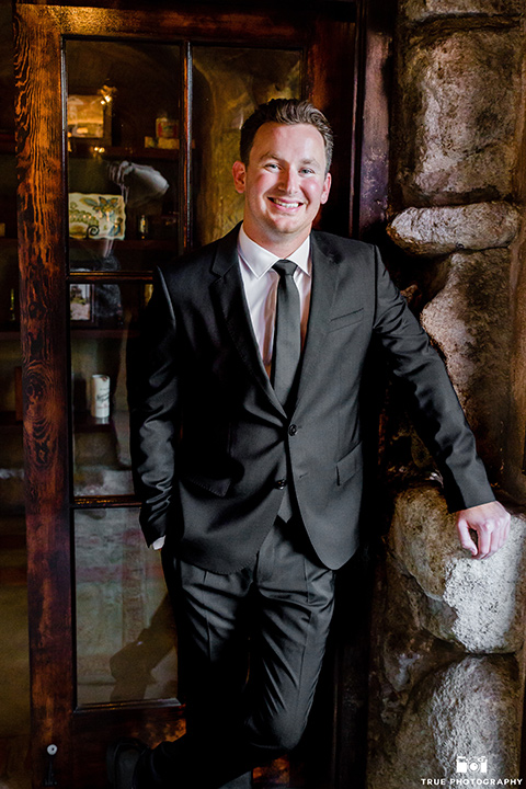 mount-woodson-castle-groom-in-a-charcoal-suit-with-a-black-long-tie