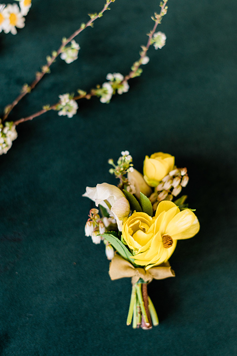 malibu-lodge-spring-wedding-shoot-boutionnere-with-a-yellow-flower