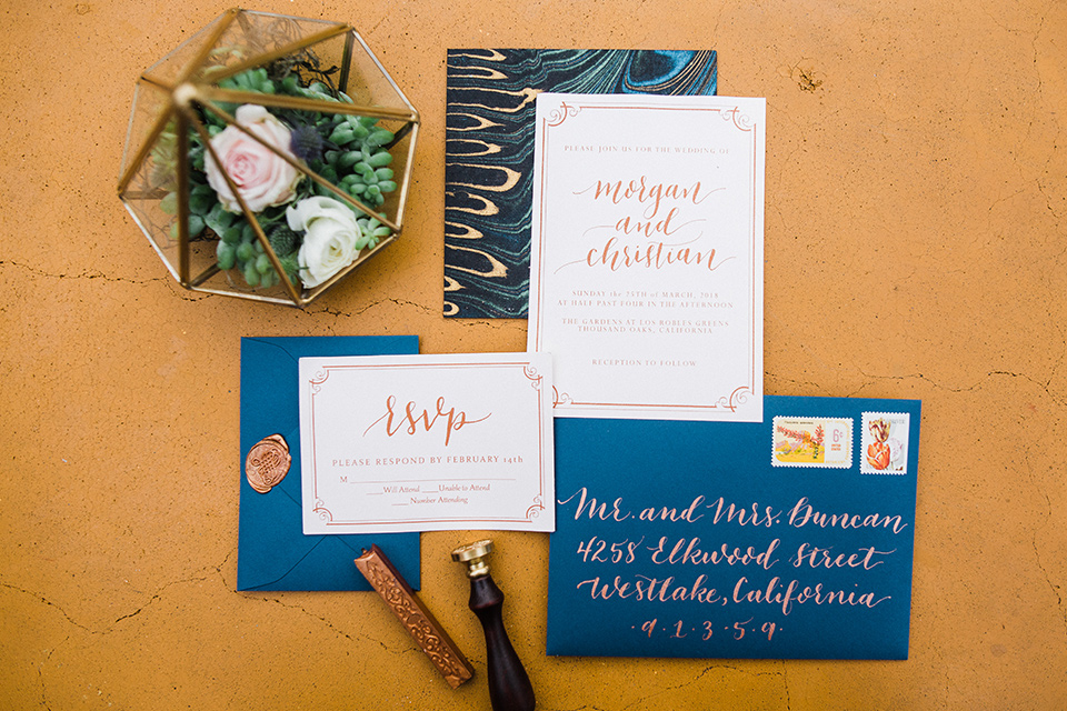 Los Robles Greens Shoot invitations with blue envelopes and yellow writing