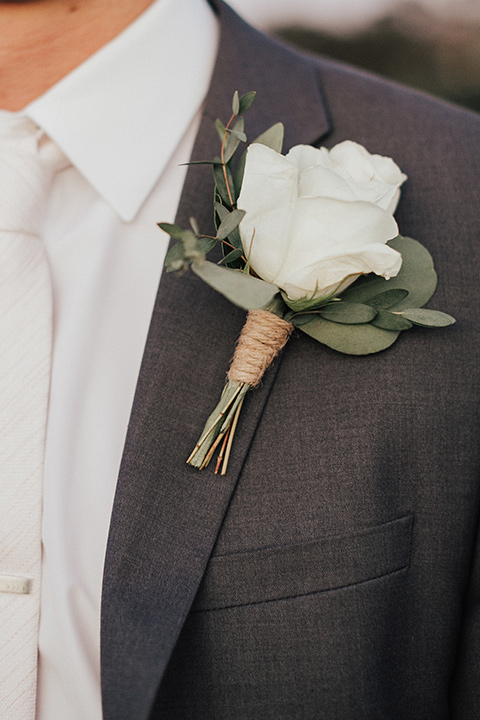 monarch-beach-resort-close-up-on-jacket-groom-in-a-grey-suit-with-ivory-long-tie