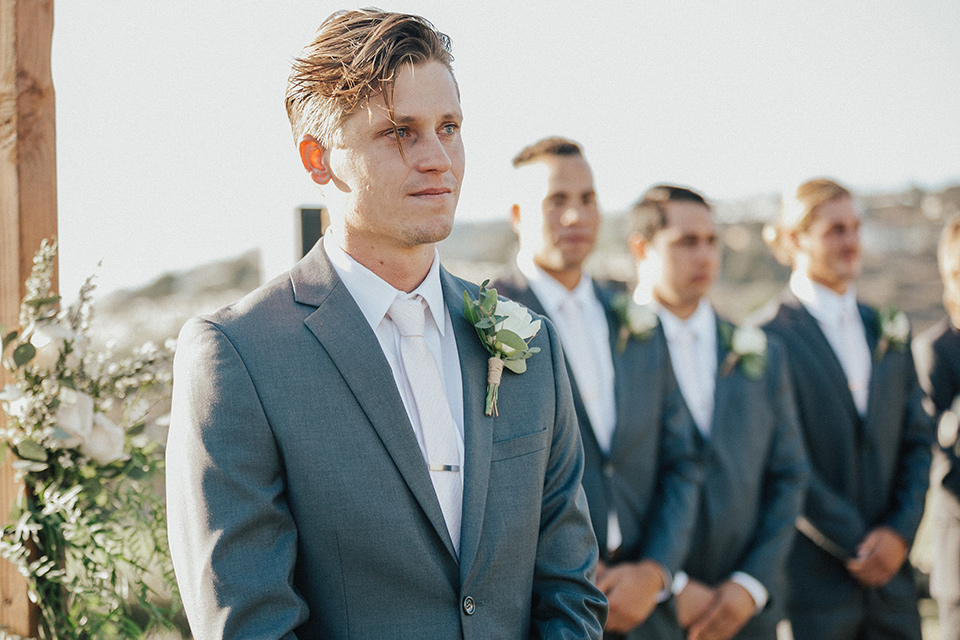 monarch-beach-resort-groom-at-ceremony-groom-in-a-grey-suit-with-ivory-long-tie