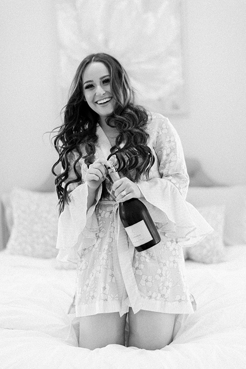  bride in a silk robe with champagne 