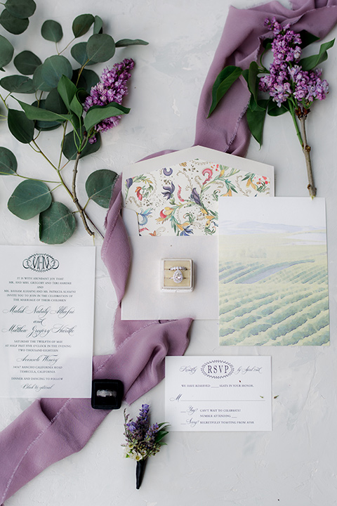  white invitations with green accents 