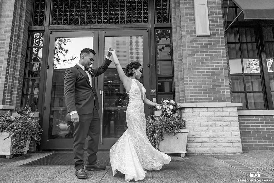 skybox-real-wedding-bride-and-groom-tworlin-bride-wearing-a-fitting-lace-dress-with=straps-groom-wearing-a-blue-suit-bridesmaids-in-burgundy-groomsmen-in-blue