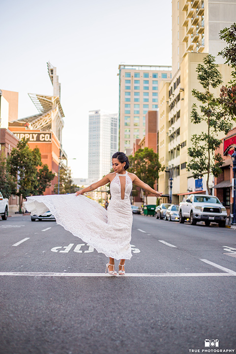 skybox-real-wedding-bride-twirling-in-the-street-bride-wearing-a-fitted-lace-dress-with-an-illusion-neck-line