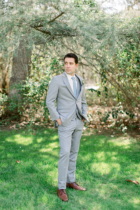 Temecula-Creek-Inn-Wedding-groom-with-hands-in-pockets