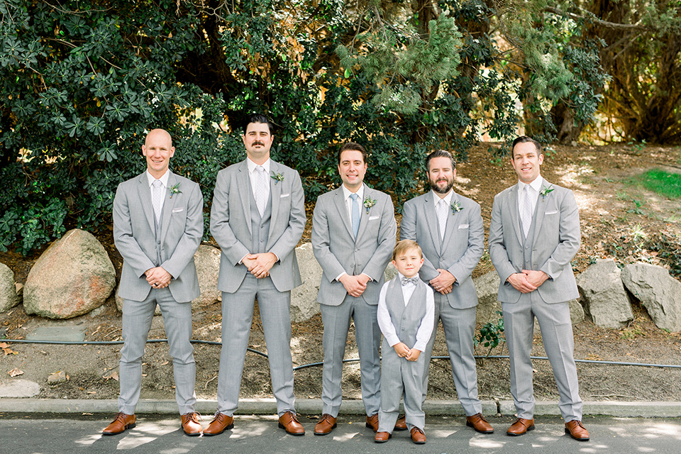 Temecula-Creek-Inn-Wedding-groom-and-groomsmen-in-light-grey-suits-with-light-blue-ties
