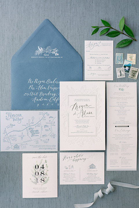 Temecula-Creek-Inn-Wedding-invitations-in-blue-envelopes-and-white-paper