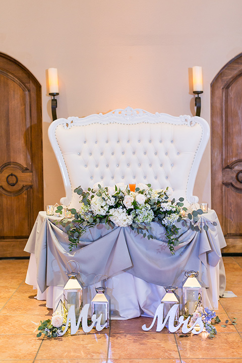  sweetheart tables with white linens and purple accents