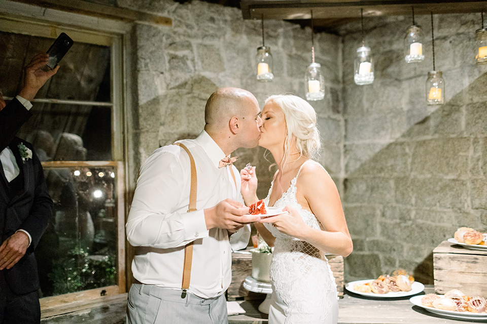 wedding bride and groom cutting the cake