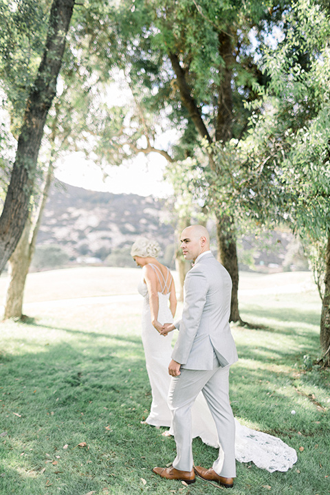 Bride and groom pose for a photo at the Temecula Creek Inn