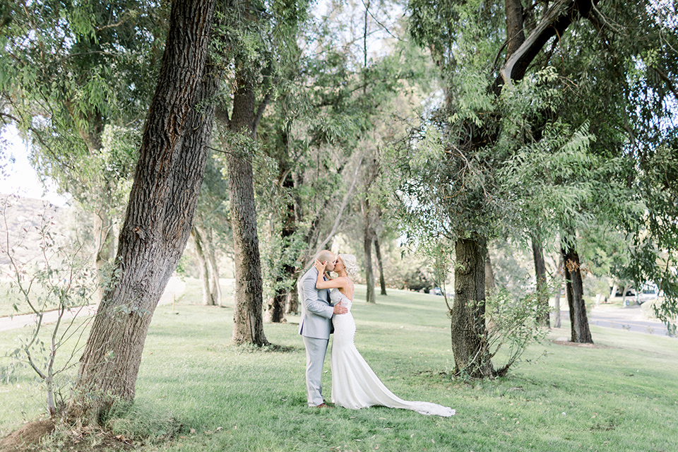 Bride and groom kissing in a wedding photo at Temecula Creek Inn