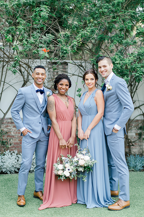  bridesmaids in a coral gown + light blue gown and the groomsmen in a light blue suit