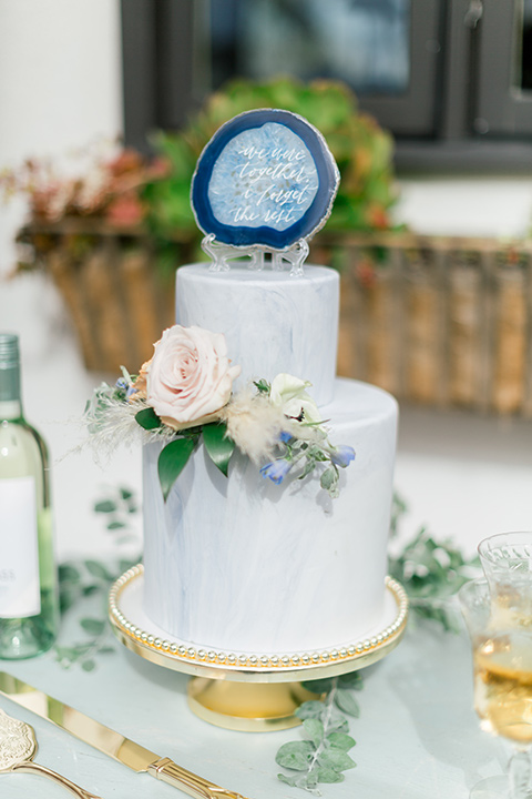  white cake with a simple green and yellow floral design