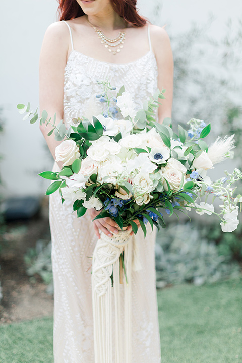  bride close up with white floral boquet 