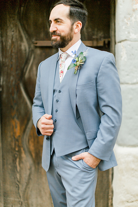  groom in light blue suit and floral tie