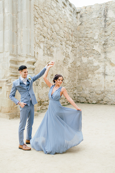  bridesmaid in a light blue gown with a light blue suit 