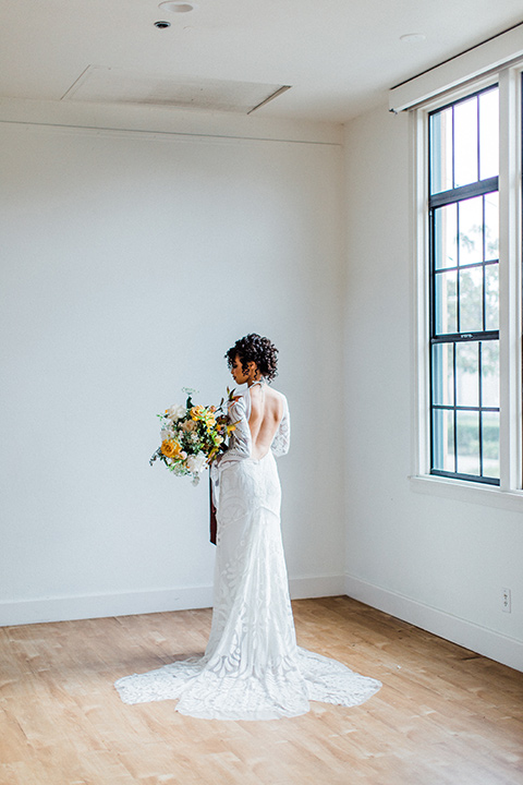 modern Moroccan shoot bride in a white lace gown with long sleeves and a v neck line