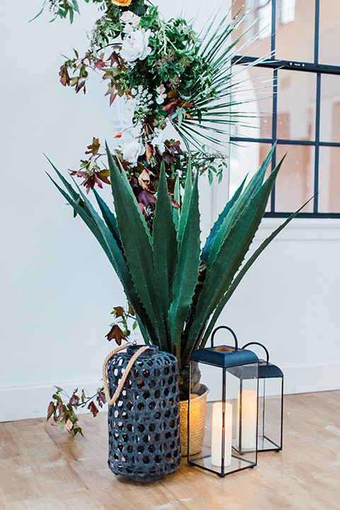 modern Moroccan shoot ceremony décor with palm leaves and gold accents