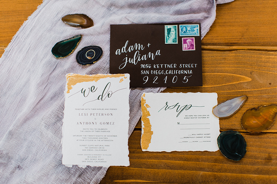 modern Moroccan shoot white invitations with black envelopes and gold accents