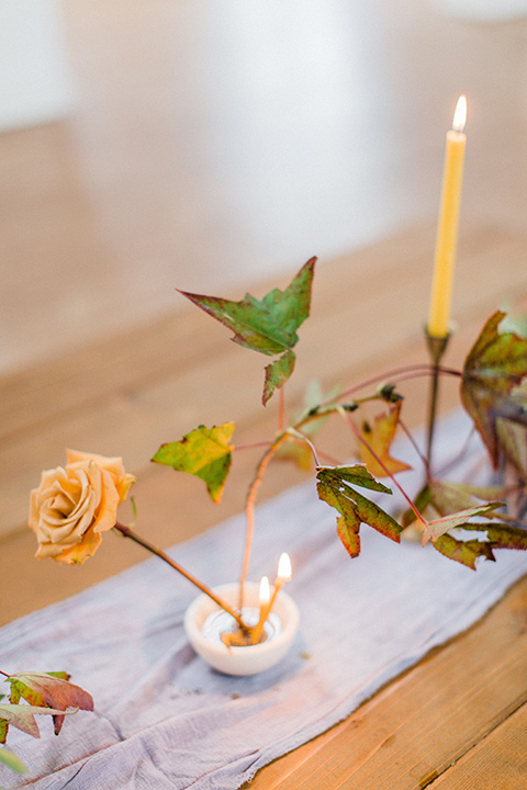 modern Moroccan shoot reception décor with soft linen table runners and single flower centerpieces