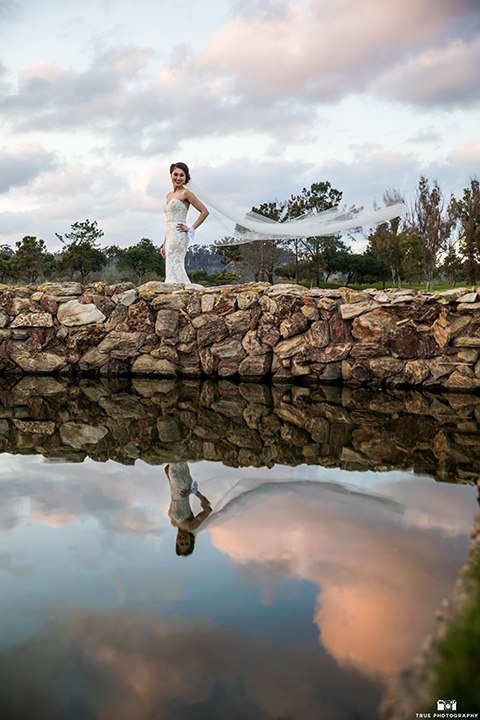  bride in a lace white gown with a strapless neck line 