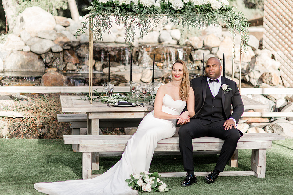 Oak meadows shoot bride and groom sitting at the sweetheart table