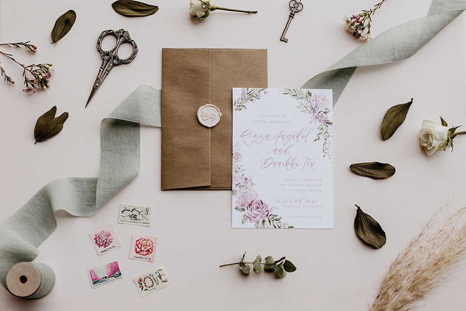 Owl-Creek-Farms-shoot-invitations-in-white-with-a-sage-green-envelope-and-a-soft-boho-floral-design