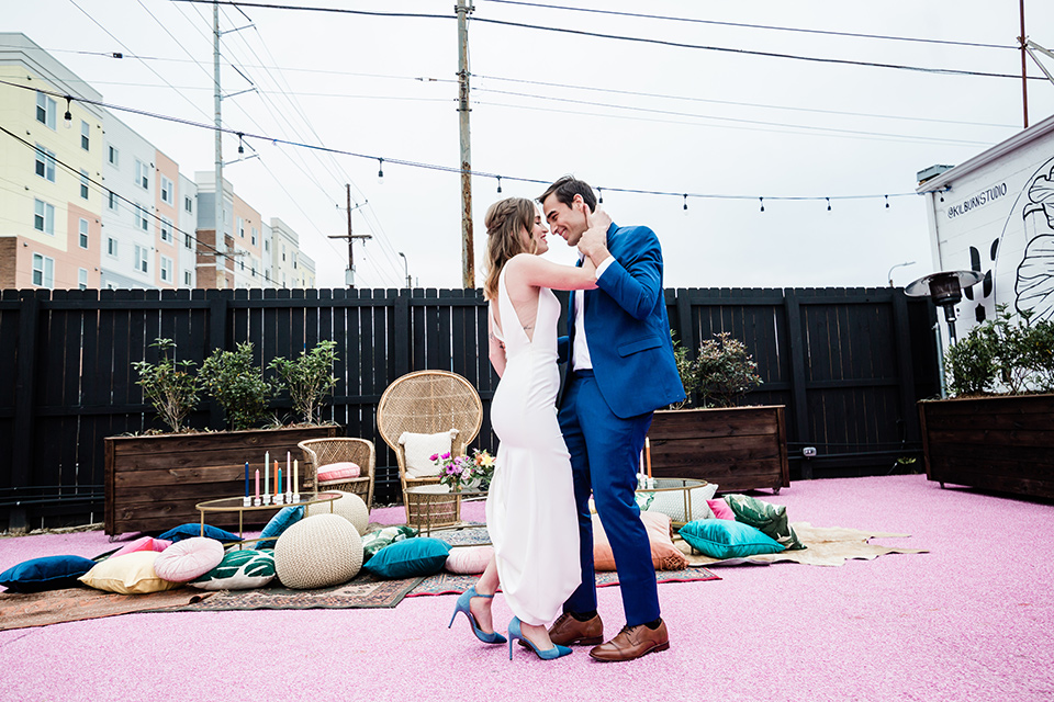 groom in a bright cobalt suit with brown shoes