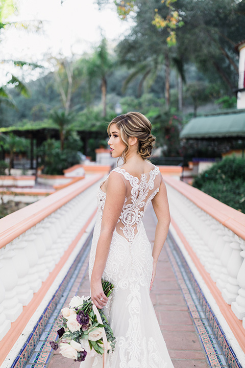rancho-las-lomas-wedding-back-detailing-of-dress-with-an-illusion-detail-and-straps-with-lace-on-the-dress